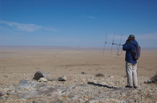 Jed-radio-telem Jed Murdoch searching for a collared Pallas Cat; he never got a signal and the cat had vanished, April 2005