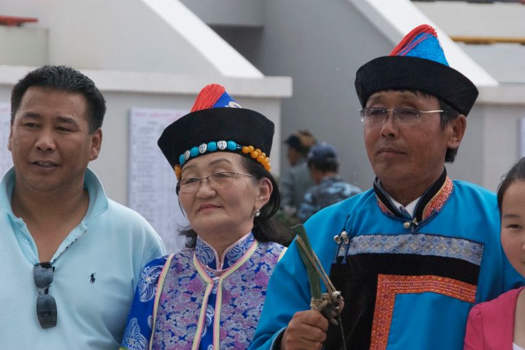 Winning archer, his wife and a fan