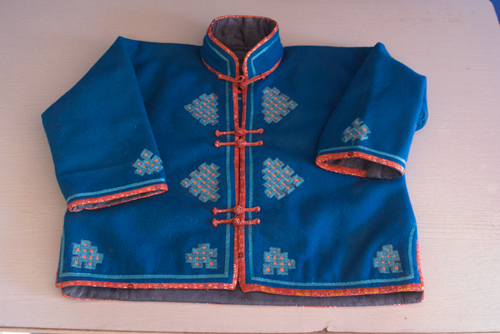 One woman also brought this child's khurem, or jacket, that she made, wanting to sell it because it was too big. 