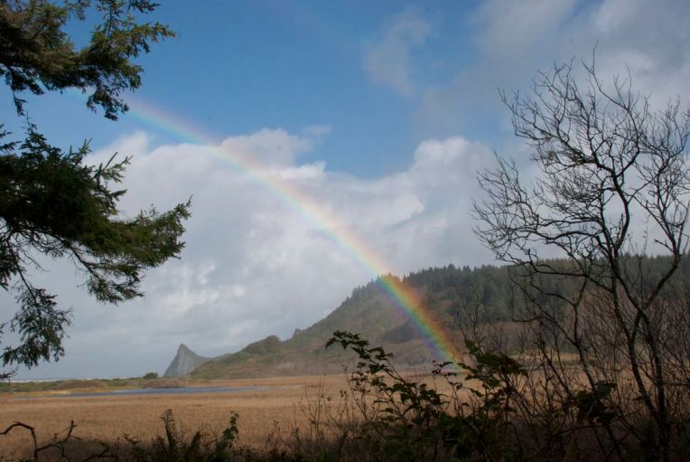 Rainbow at Dry Lagoon State Park with Goat Rock in the background.