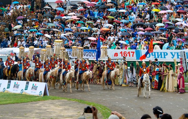 Procession into the naadam stadium with the official State horsetail standards
