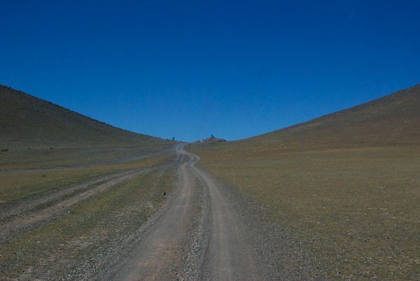 Up another hill, on a typical earth road.