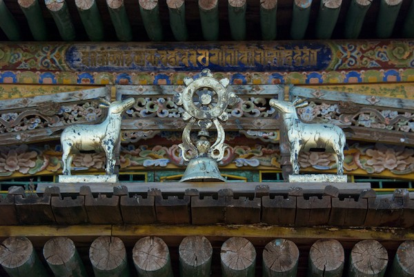 Buddhist symbol set of deer and wheel over door