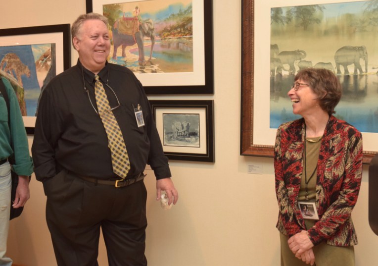 David Rankin in front of his work and Karryl