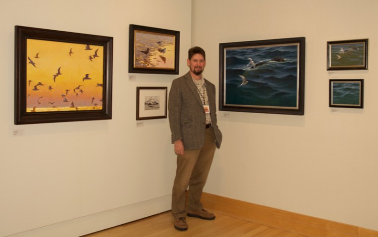 Sean Murtha with some of his work